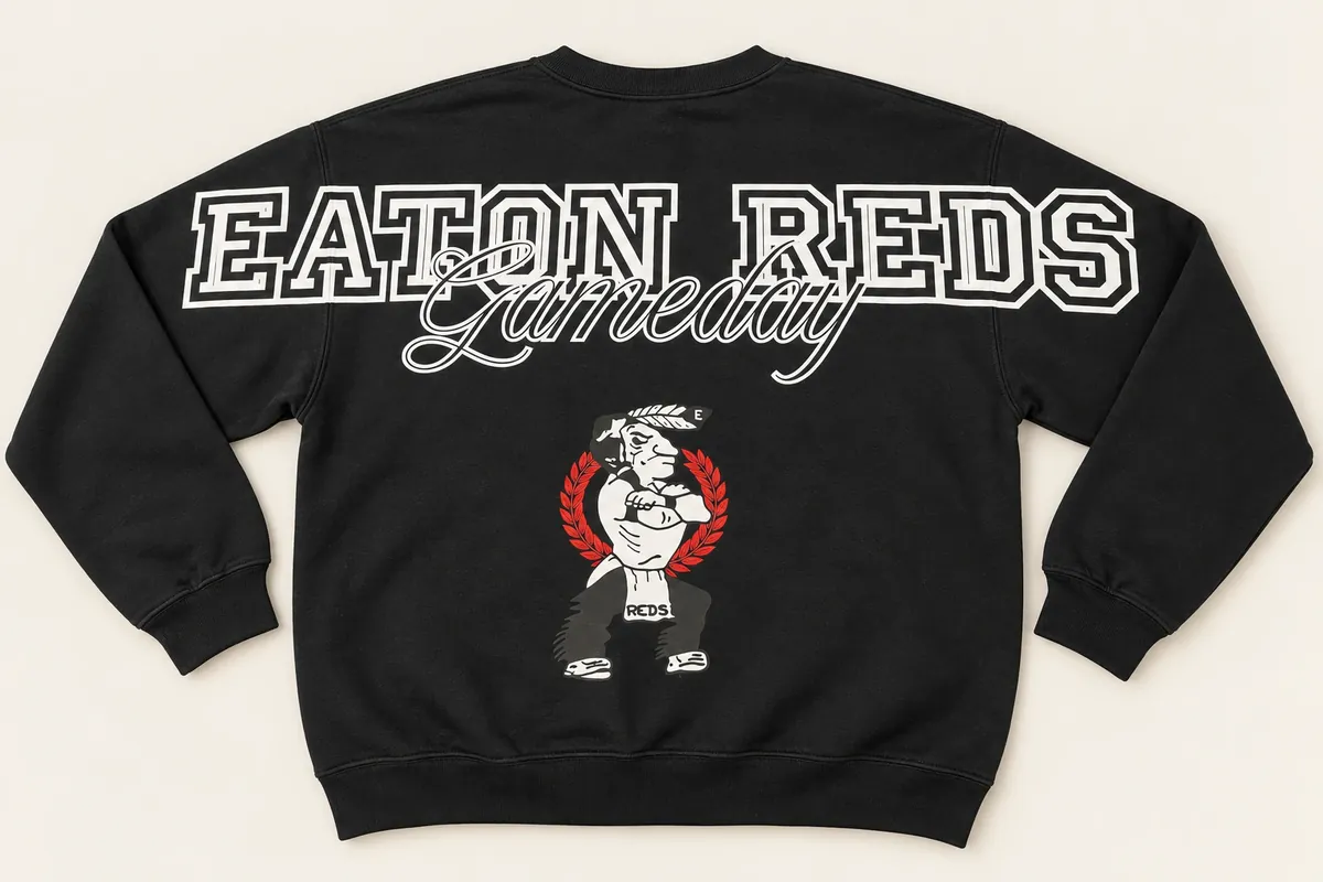 Back of a black crewneck sweatshirt: EATON REDS across the shoulders and sleeves, Gameday in script, and the team mascot