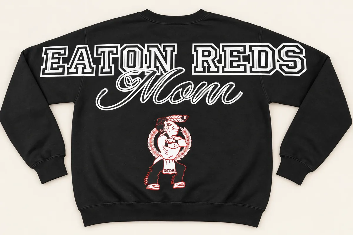 Back of a black crewneck sweatshirt: EATON REDS across the shoulders and sleeves, Mom in script, and the team mascot