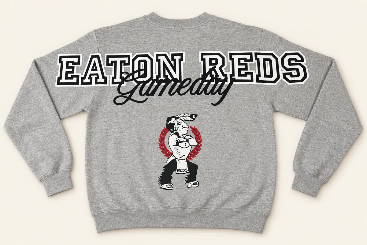 Back of a grey crewneck sweatshirt: EATON REDS across the shoulders and sleeves, Gameday in script, and the team mascot